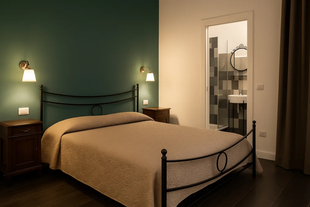 Camera di Gabriella House, B&B realizzato a Catania, con letto in ferro battuto